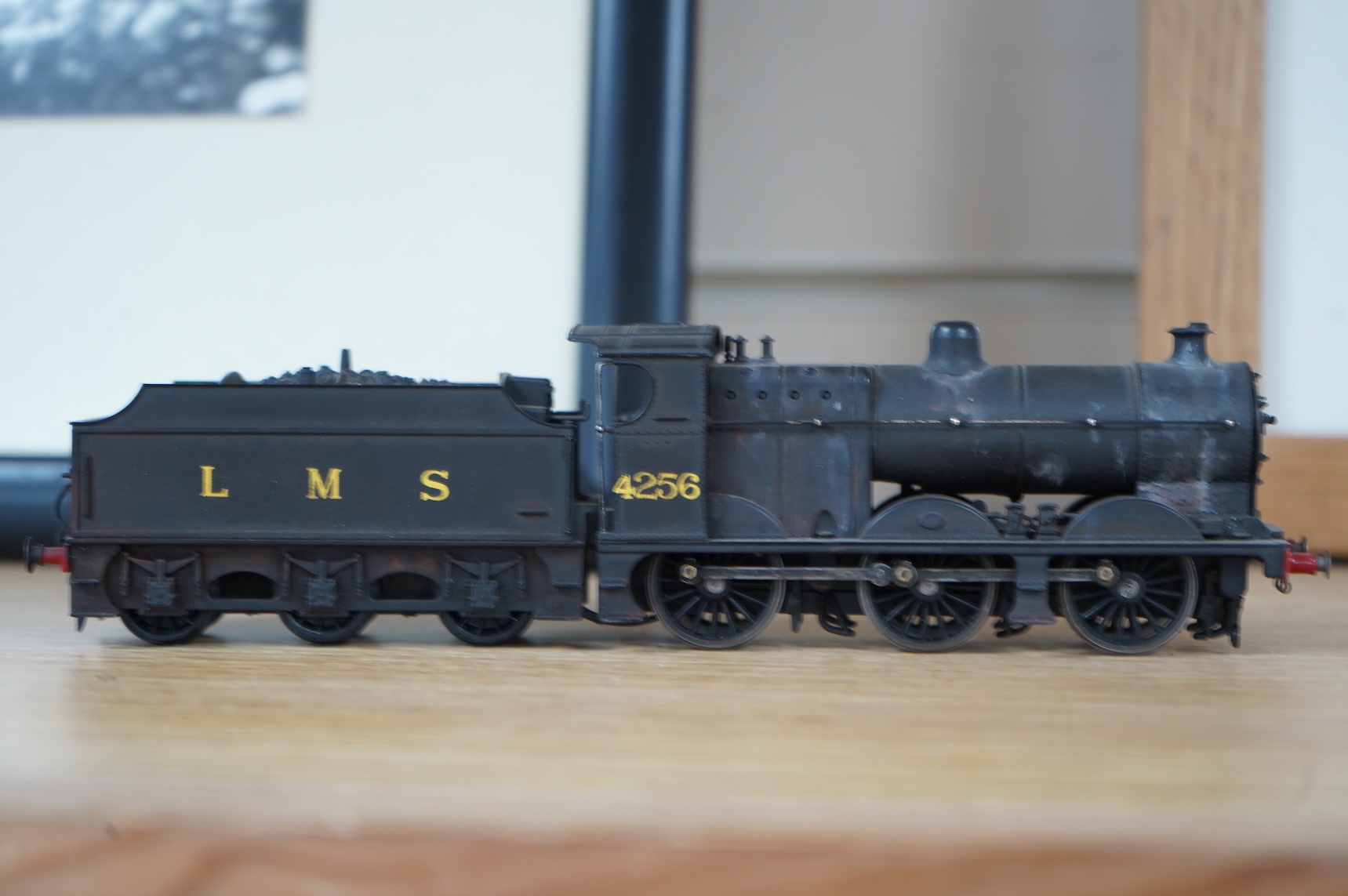 Two kit built and adapted EM gauge LMS railway locomotives; an 0-8-0, 9518, and an 0-6-0 class 4F based on an Airfix kit, together with the body only of an SR Schools Class